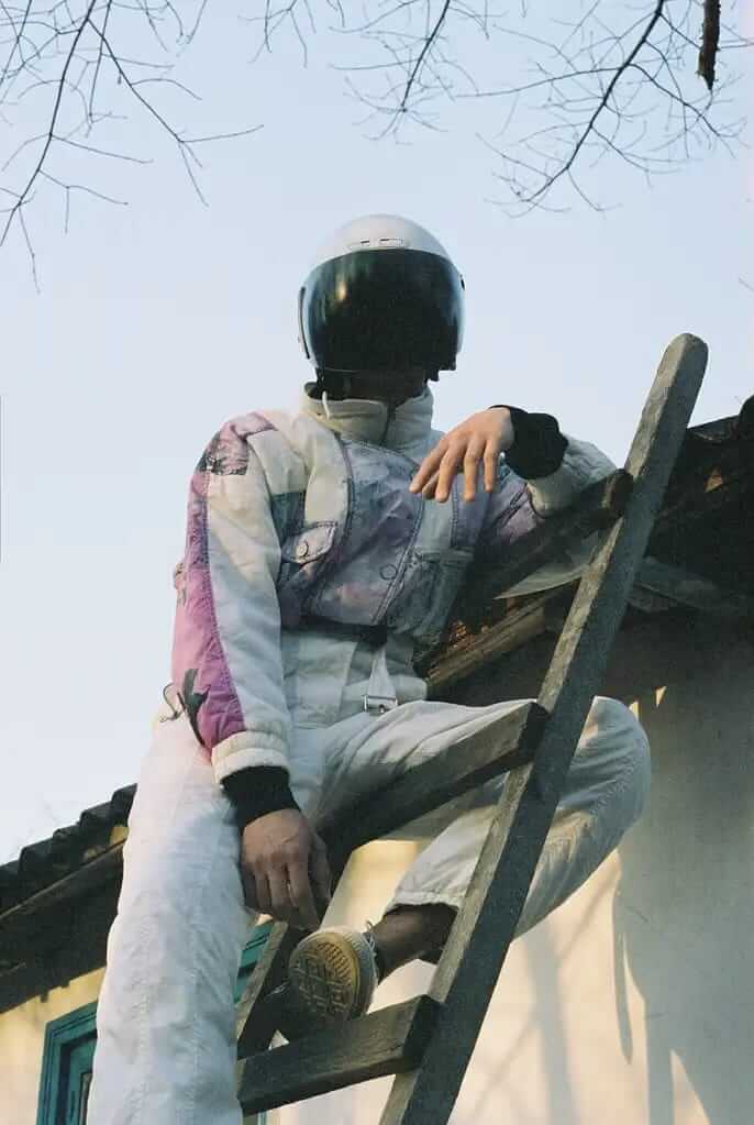 An astronaut on a ladder.