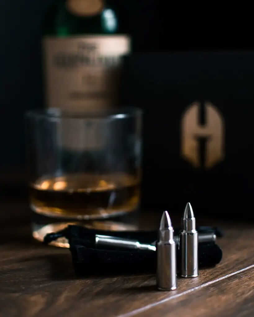 Silver bullets lined up on a table.