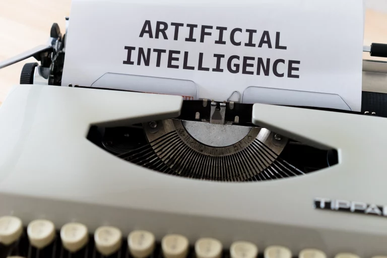 Typewriter page with the words "Artificial Intelligence"